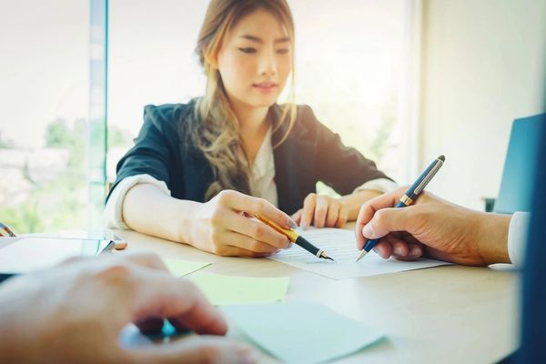 Woman Discussing Strategy in Conference