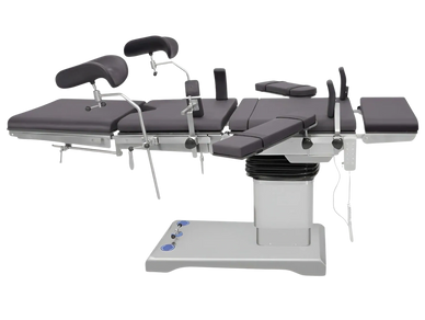 Modern adjustable medical examination table with padded sections and support attachments.