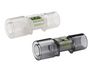 Two transparent flow sensors, one clear and one dark, showing internal electronics.