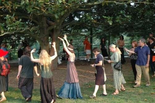 Wiccan Sabbat celebration of coven members and friends chanting and honoring the Goddess. 