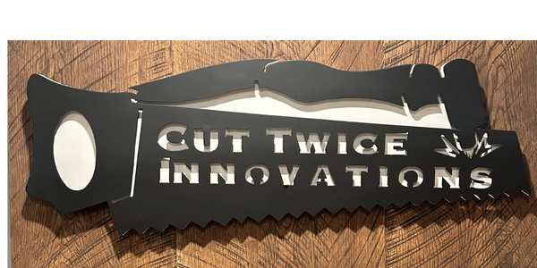 Metal signage of Cut Twice Innovations' logo 
