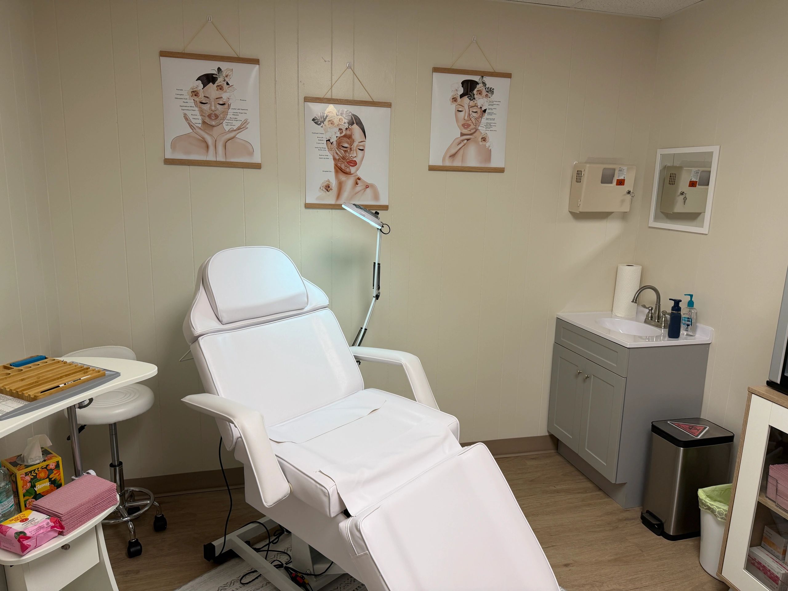 Clean, professional medical spa treatment room with neutral tones at Refinement And Rejuvenation Room Ll in Stuttgart