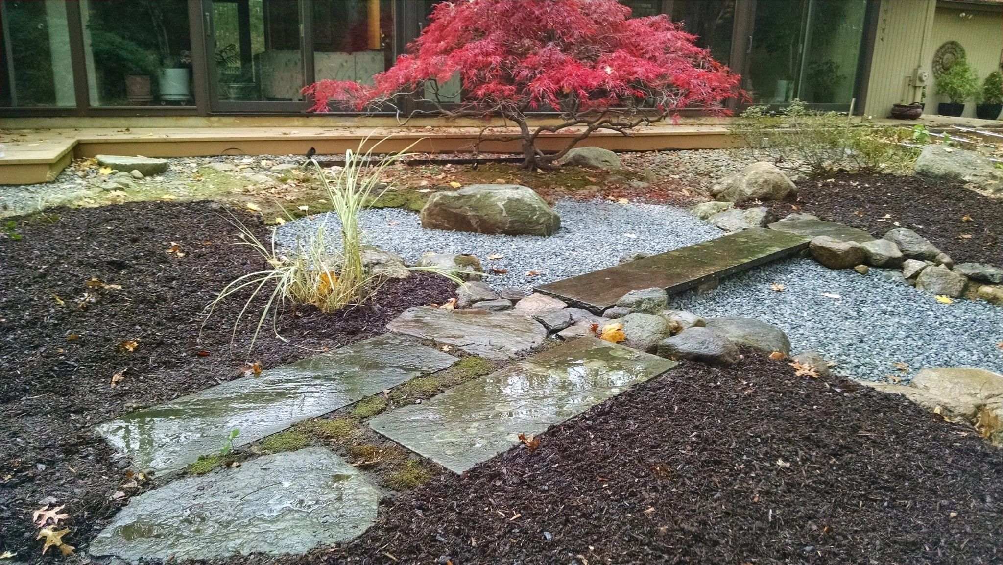 Japanese-inspired garden with stone path and organic mulch