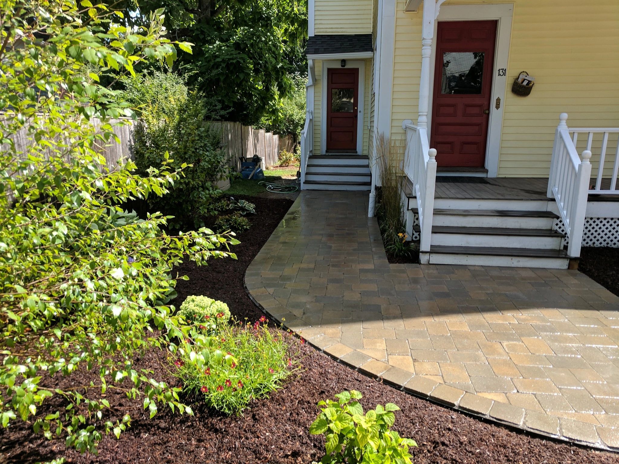 Elegant double door entryway with landscaped approach