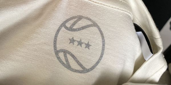 Screen printed neck label. GMN football style print.