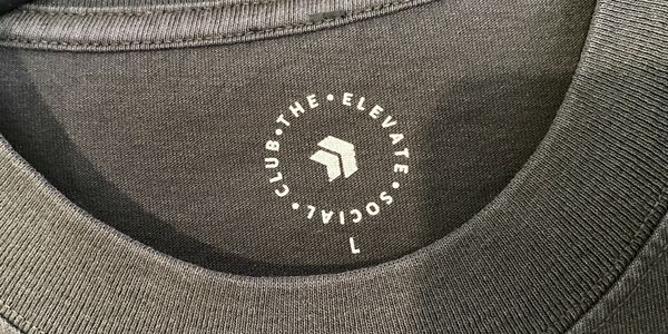 Screen printed neck label, white ink on a grey neck position for a running club design.