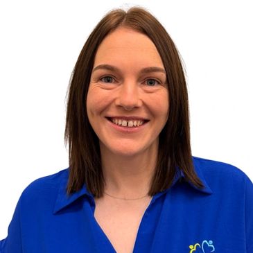 woman with dark hair in a blue shirt