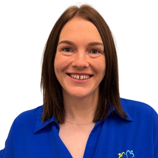 woman with dark hair in a blue shirt