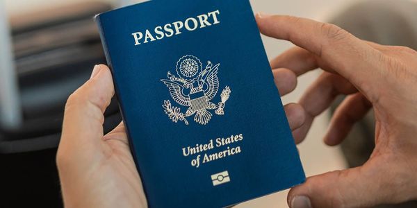 Person holding a United States passport in their hands.