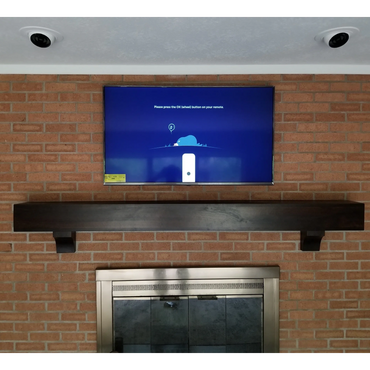 brick fireplace after tv mount and electric receptacle installation
