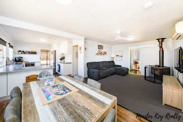 Open living and dining area with neutral tones.