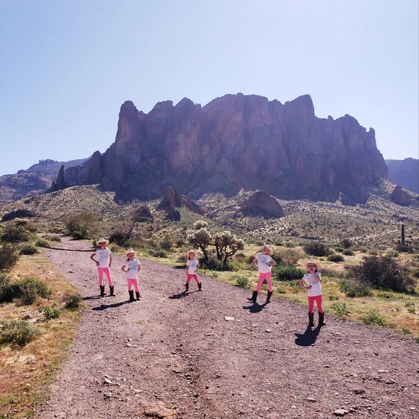 Five girls in front of a mountain