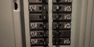 Circuit breakers neatly arranged inside an electrical panel.