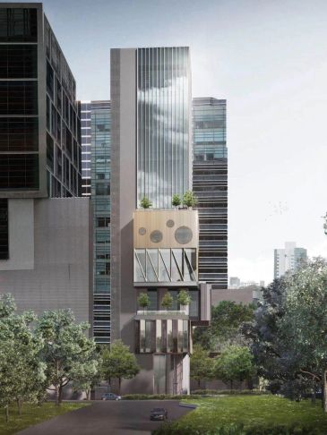 Modern tall building with unique geometric design and greenery.