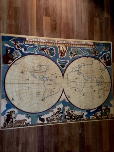 Old-world map inlay made from natural wood tones, custom-installed by Sonnier’s in Carencro, LA