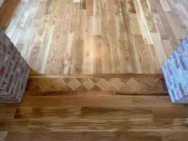 Hardwood floor with custom inlay detail in Youngsville, LA