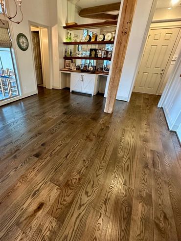 Hardwood floor installation and refinishing near home bar in Youngsville, LA