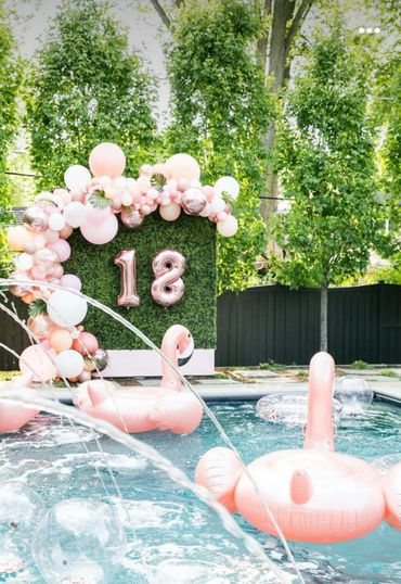 Pool Party theme Flamingo hedgewall with balloon garland