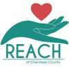 Logo of REACH of Cherokee County with a hand and heart symbol.