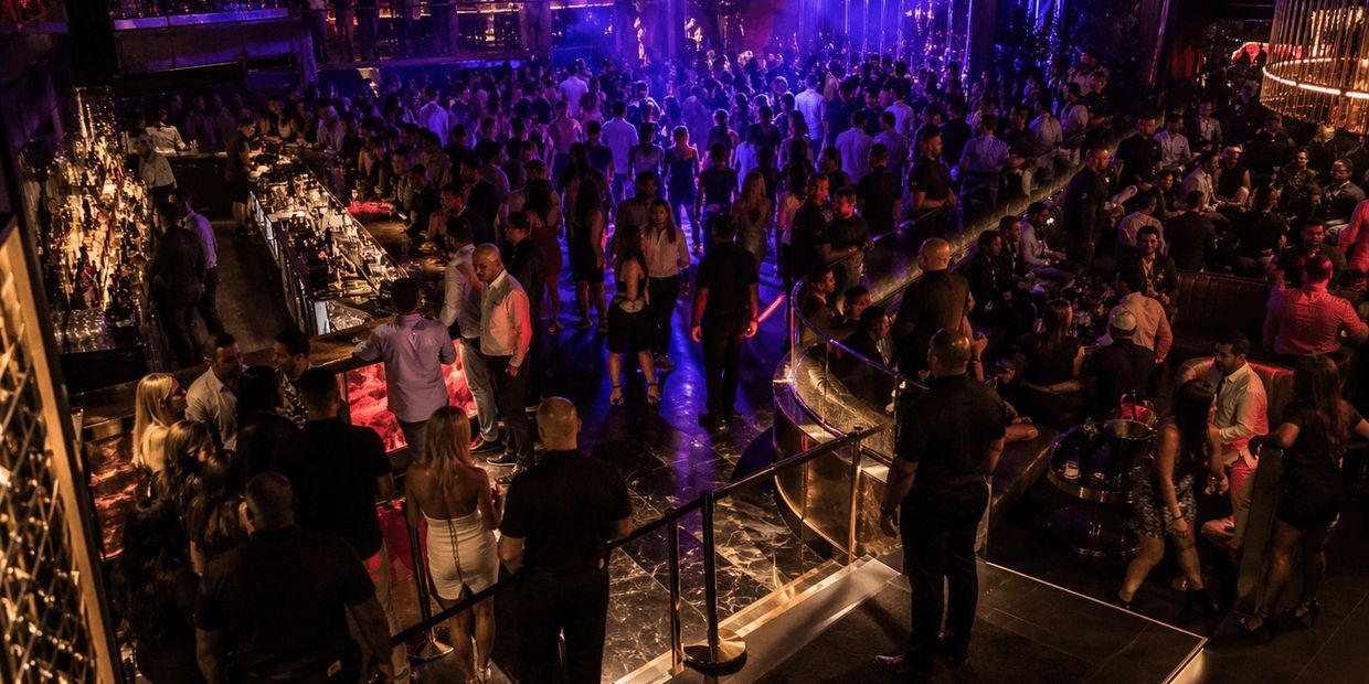 upscale miami nightclub showing full security system across entrance bar dance floor and vip zones