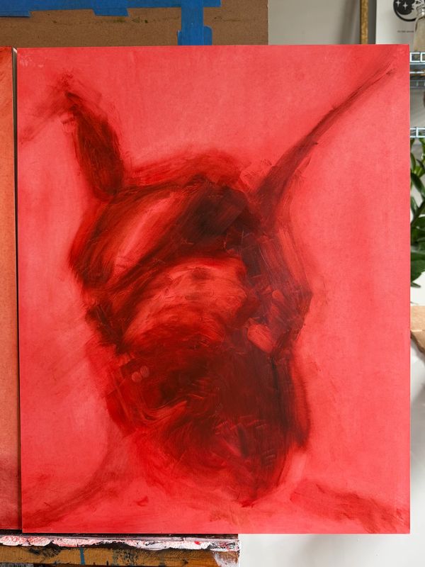 Abstract red painting with dark strokes suggesting a horned figure.