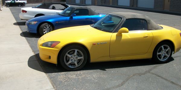 Three convertible tops in front of Tucson Tops