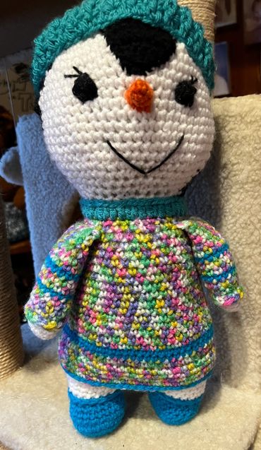 crocheted penguin in dress