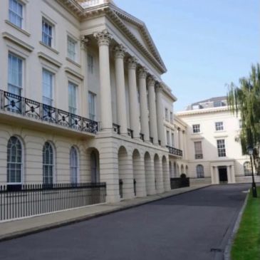 Elegant classical building with columns and arches.