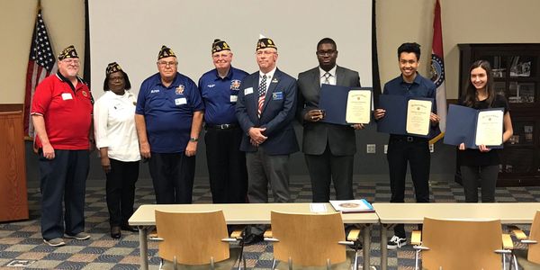 Post members pose with American Legion Oratorical Contestants at Staley High School.