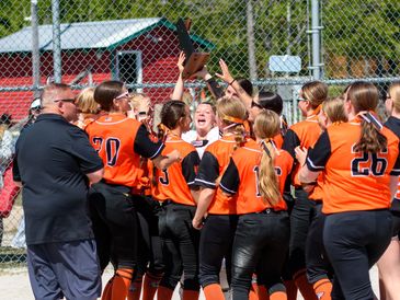 Softball team celebrating