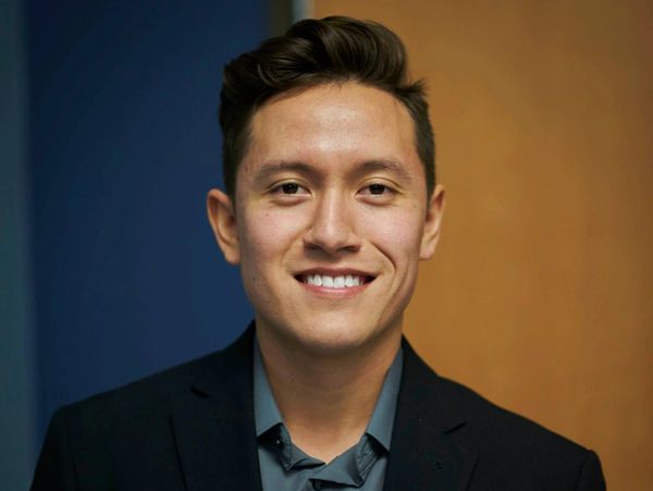 Alejandro smiles