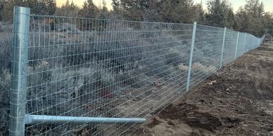 High tensile non climb mesh installed professionally on SS40 pipe Rance Brace in Central Oregon