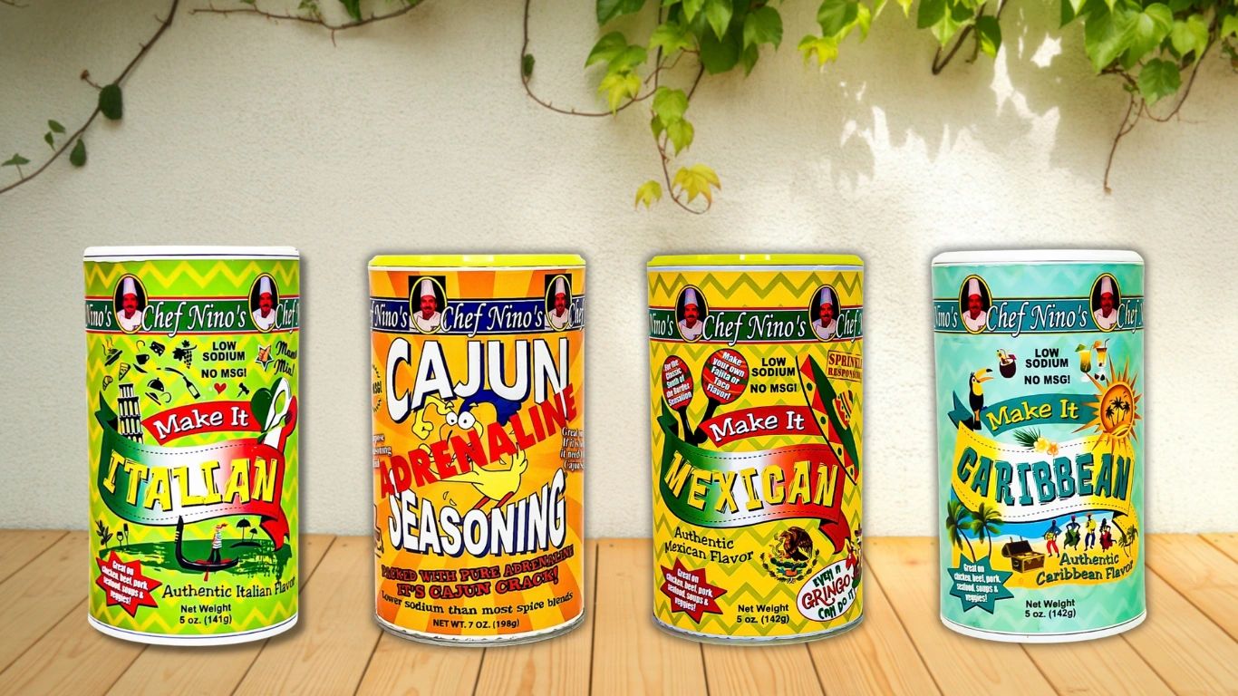 Four colorful Chef Nino's seasoning cans with Italian, Cajun, Mexican, and Caribbean flavors.