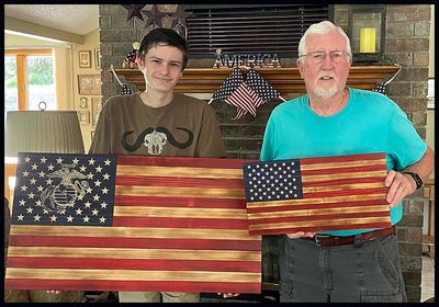 Photo shows the two sizes of wooden flags we make.