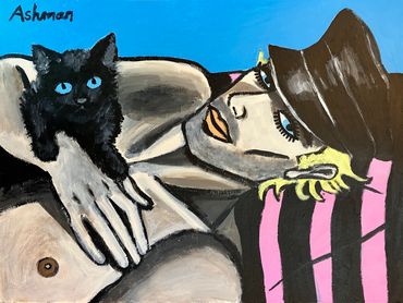 A Man lying down holding a black Kitten, wearing a black cap against a background of a blue sky.