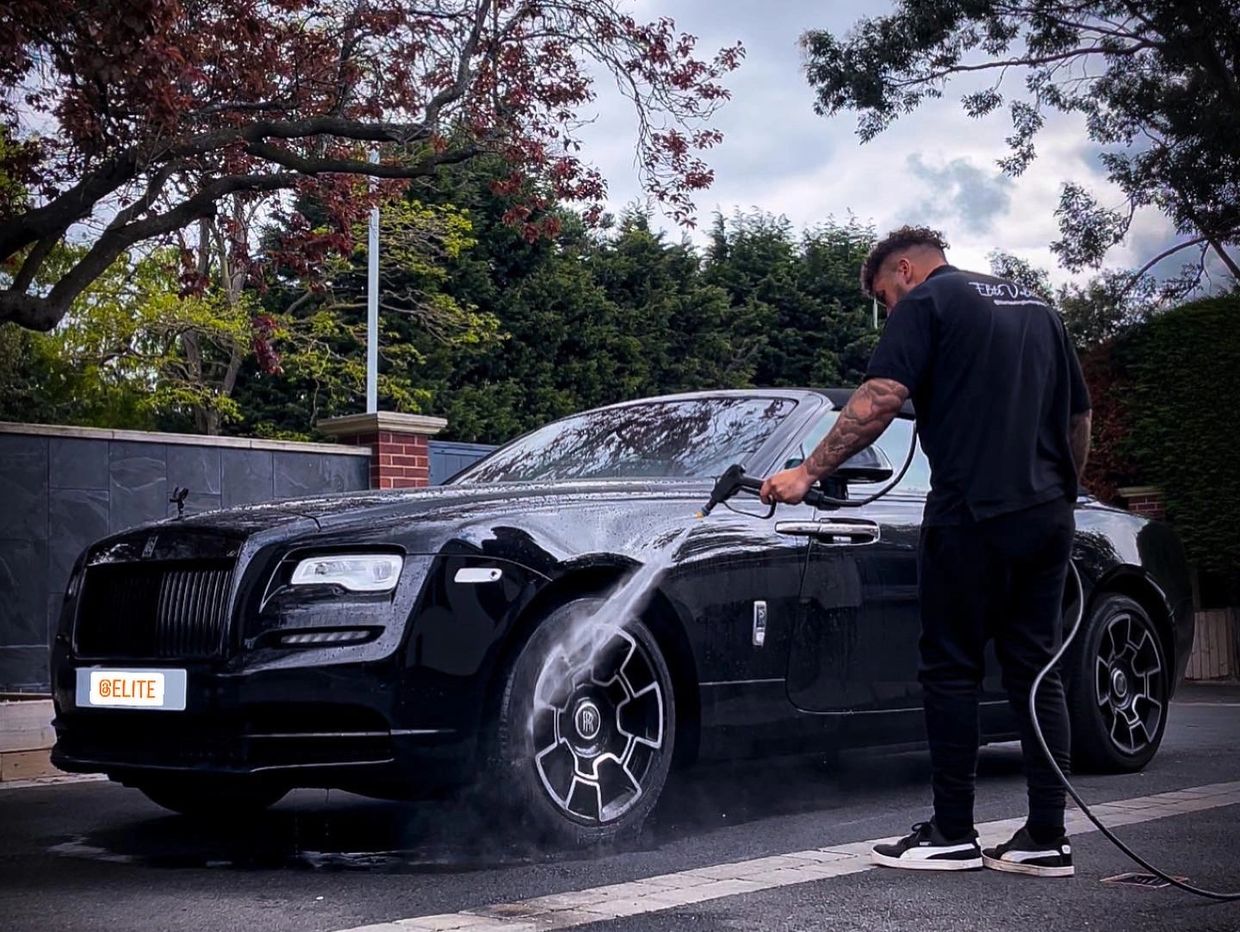 Man cleaning and valeting a rolls Royce in Nottingham. 