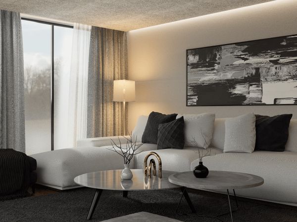 Modern living room with gray and black decor and natural light.