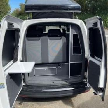 rear of white vw caddy camper