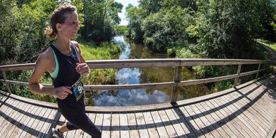 Female runner on a bridge