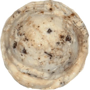 Scoop of cookies and cream ice cream in a waffle cone.