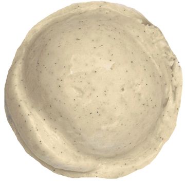 Top view of a small, speckled ceramic bowl with an uneven rim.