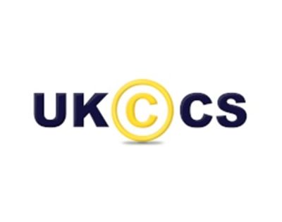 Logo with letters UK, C inside a yellow circle, and CS in dark blue.
