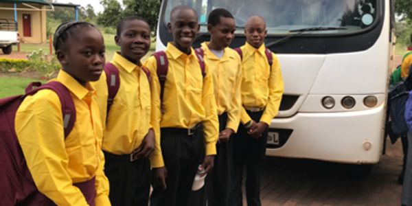 South African Children in uniform waiting for the school bus.