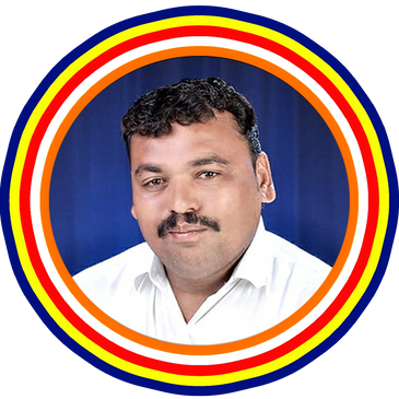 Portrait of a man with curly hair and a mustache in a white shirt.