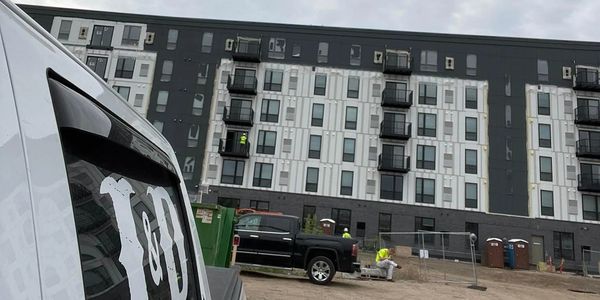 J&D Truck sitting out side of construction site for new apartment buildings