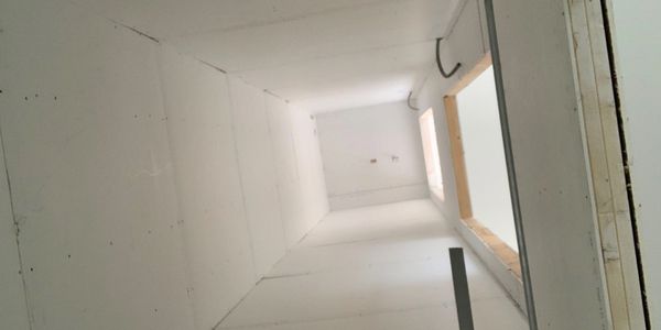 elevator shaft with drywall freshly hung