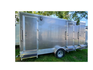 3 stall units - 1 with flush toilet /urinal, the other 2 w/flush toilets. Heated/airconditioned