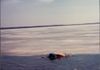 Tom DeBruyckere swimming under the ice 1980