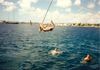 Tom DeBruyckere on Rope Swing during cruise 1989