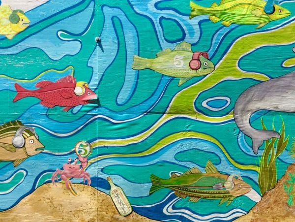 Mural of underwater creatures wearing headphones.